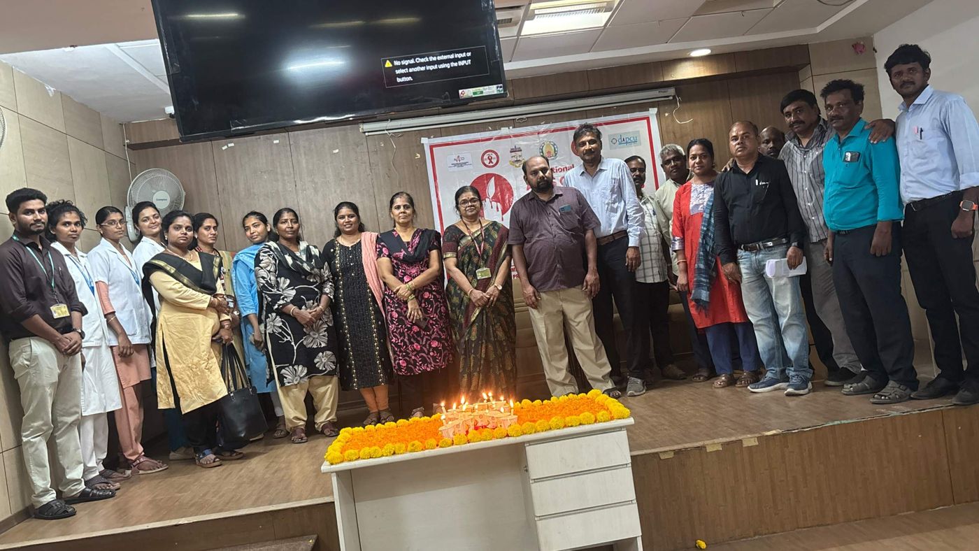 Group photo behind the lit candles